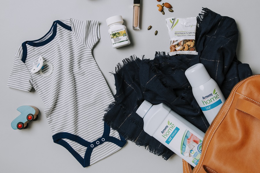 Flat lay of Amway products that support a new mom/dad lifestyle. Asset may be used across brands.