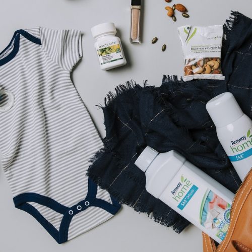 Flat lay of Amway products that support a new mom/dad lifestyle. Asset may be used across brands.